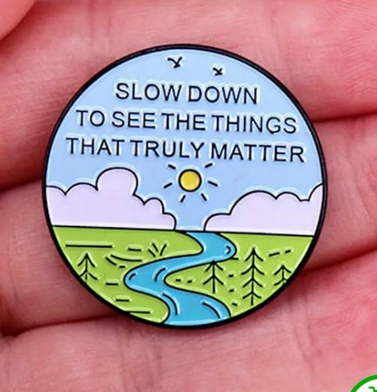 Slow down to see the things that truly matter pin badge