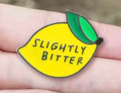 Slightly bitter lemon pin badge