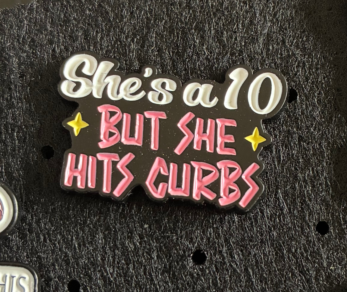 She hits curbs pin badge
