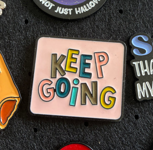 Keep going pin badge