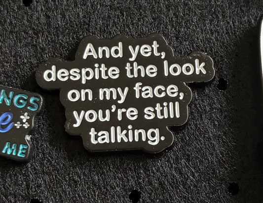 Yet despite the look on my face pin badge