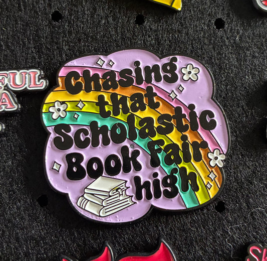 Chasing that scholastic book fair high pin badge