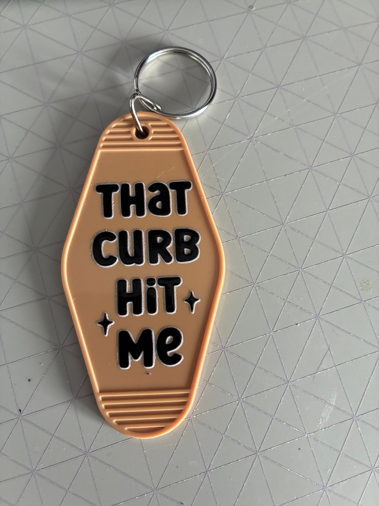 That curb hit me Motel Keyring