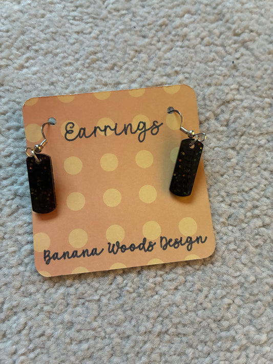 Black “fearless” dangles Resin earrings